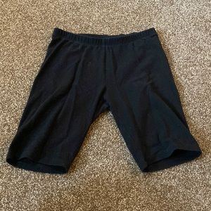 They are longer shorts, Brand is Cat and Jack, and it is black.